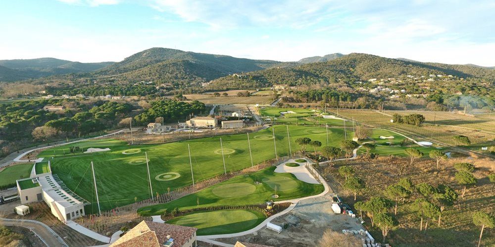 Albuquerque Aerial view of a synthetic grass golf course surrounded by hills