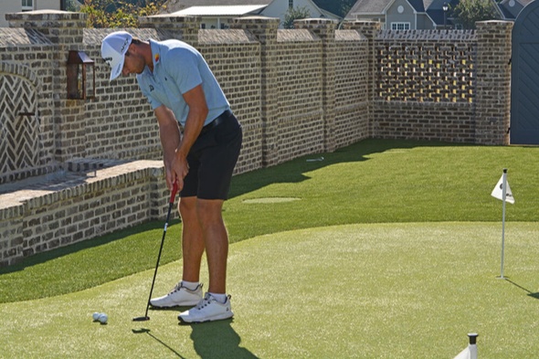 Albuquerque Golfer putting on synthetic grass