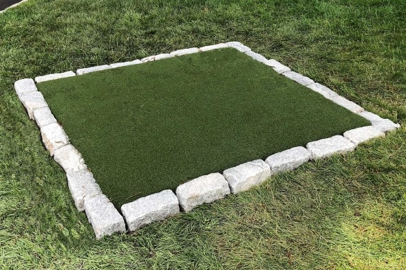 Albuquerque Tee box made of synthetic grass surrounded by stone border