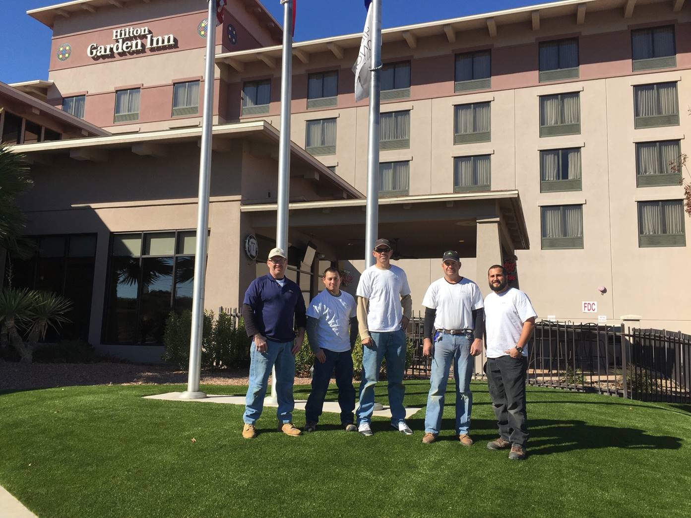 Team at Hilton Garden Inn Southwest Greens team stands outside Hilton Garden Inn